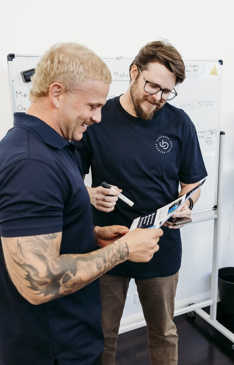 Two Brothers working through paperwork together